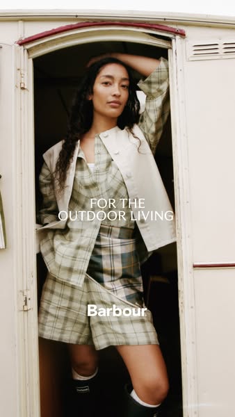 This ad features a model wearing a coordinated outfit by Barbour, ideal for outdoor activities. The visual style and bra