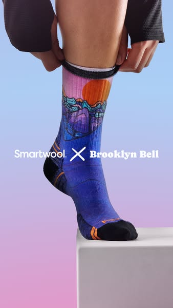 This ad highlights a sock from Smartwool's collaboration with Brooklyn Bell. The focal point is a close-up shot of a