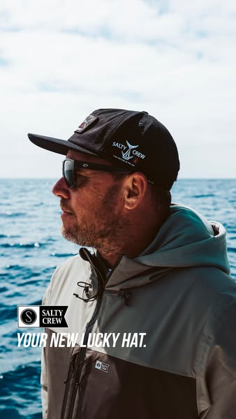 This ad features a man on a boat wearing a Salty Crew hat. The text reads "Your New Lucky Hat."