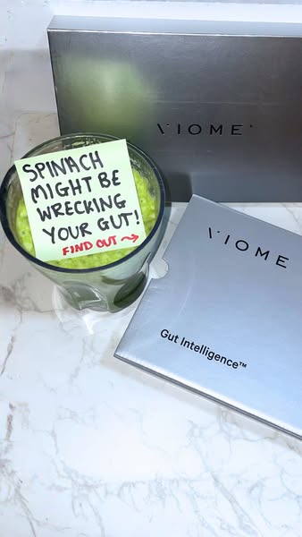 This ad highlights the Viome gut intelligence product by presenting it next to a glass of spinach smoothie and a sticky 