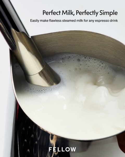 The ad showcases a Fellow milk steaming pitcher with a close-up shot of milk being steamed, emphasizing its simplicity a