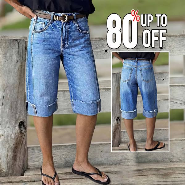 An ad for men's cuffed denim shorts, showing a person modeling them in an outdoor setting with a large graphic indic