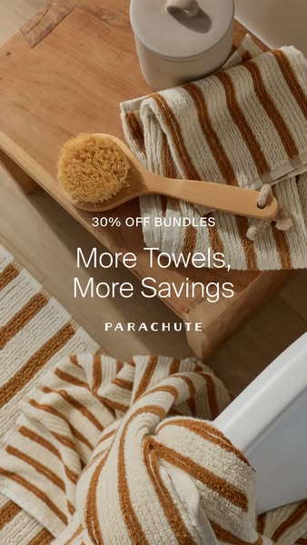 An overhead product shot featuring Parachute towels and a wooden bath brush is advertising a discount of 30% off bundles