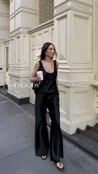 This ad features an image of Zoe Stewart wearing a silky, black Shona Joy lounge set, suggesting a comfortable yet styli