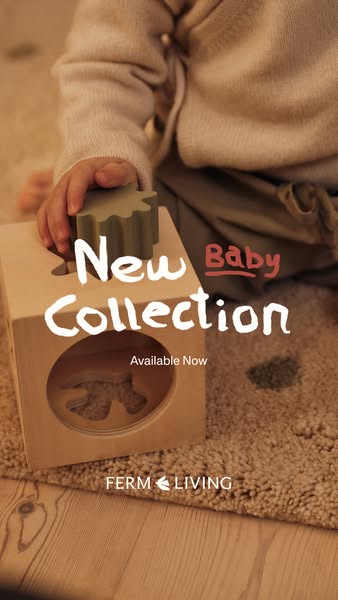 This image promotes Ferm Living's new baby collection using an image of a baby playing with a wooden shape sorter to