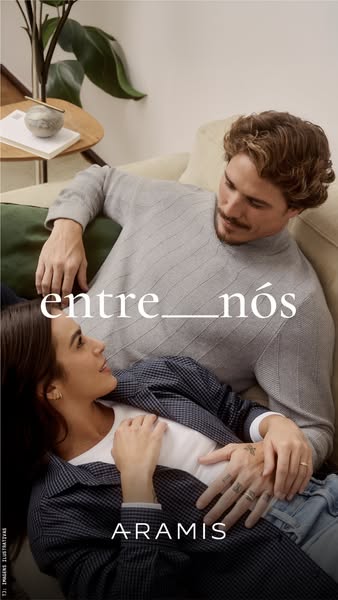 An image ad for Aramis featuring a couple relaxing on a couch in what appears to be Aramis apparel.