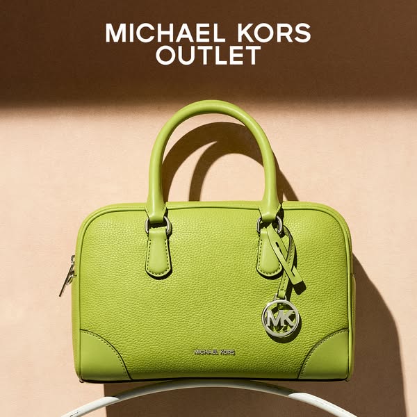 This Michael Kors image ad showcases a green handbag, drawing attention with its vibrant color and simple studio shot. T