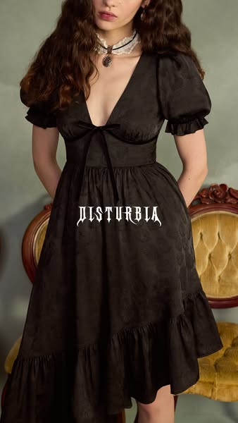 This ad is a photo of a person wearing a short, black dress with the Disturbia brand logo superimposed over it.