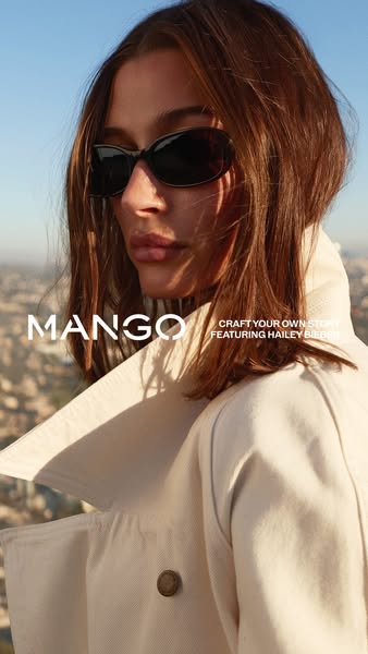 This image ad for Mango clothing features celebrity Hailey Bieber. The ad showcases Bieber wearing Mango sunglasses. The