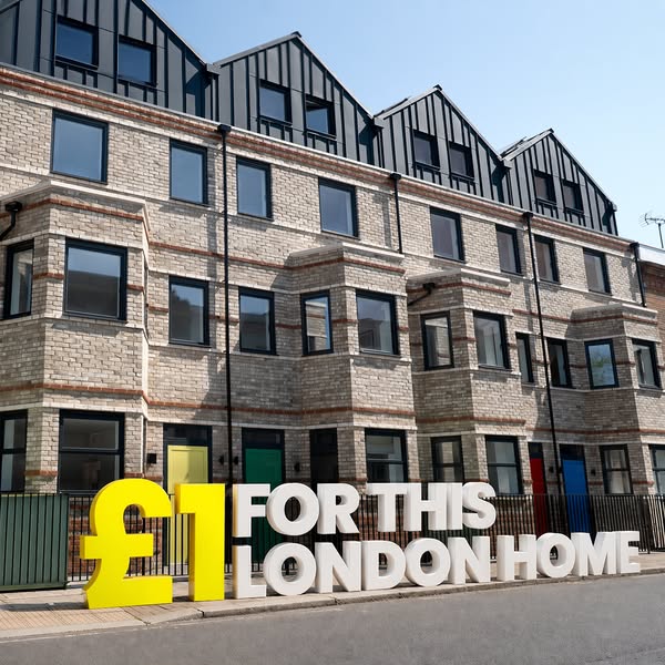 This ad showcases a modern brick townhouse and highlights an opportunity to buy a home in London for £1.