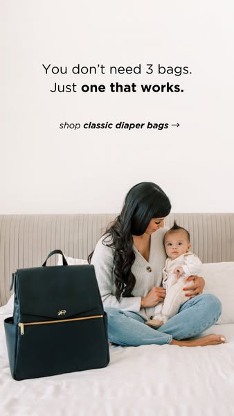 This image ad features a mother sitting on a bed holding her child and shows a diaper bag next to her. The ad promotes a