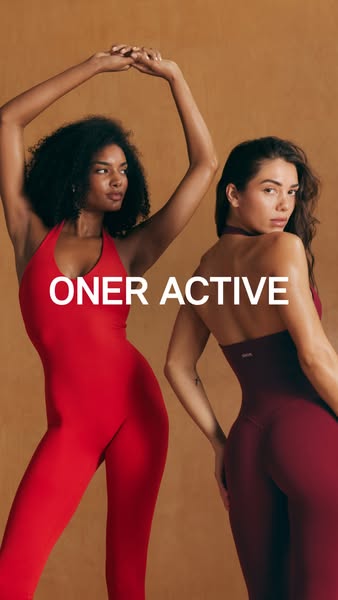 This ad showcases two women wearing Oner Active workout jumpsuits in a studio setting. The ad focuses on the fit and sty