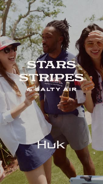 This image ad showcases a group of friends enjoying themselves outdoors while wearing Huk brand apparel. The overall the