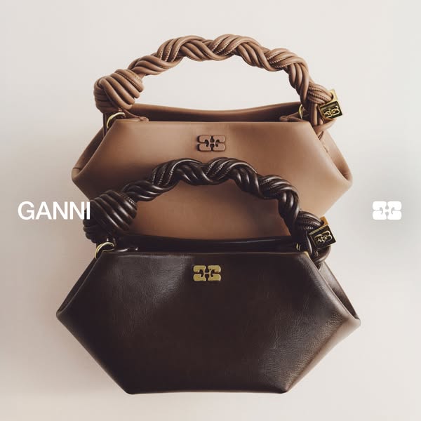 This ad showcases Ganni's signature twisted handle bag in two color variations.