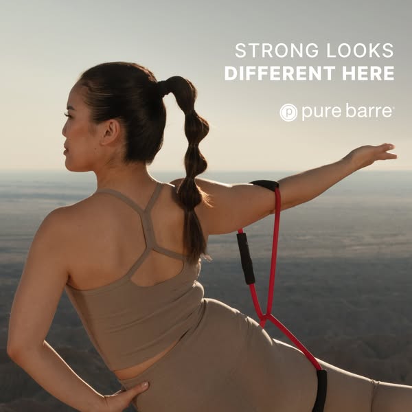 This Pure Barre image ad features a woman exercising outdoors with a resistance band, emphasizing strength through a uni