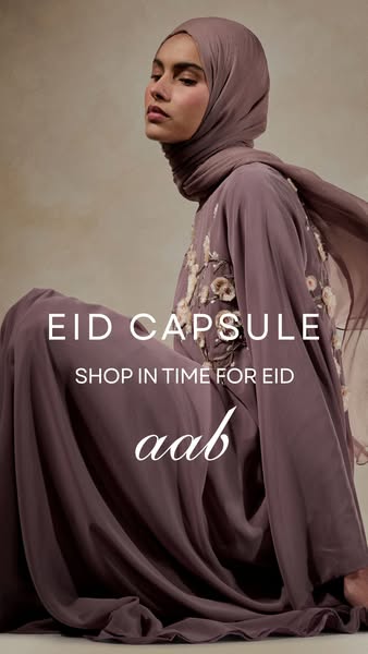 This image ad for Aab features a woman wearing a mauve-colored dress and head covering. The ad is advertising Aab's 