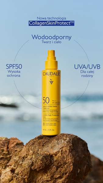 This ad features the Caudalie SPF 50 sunscreen spray. It is set on a rock with the ocean in the background. The text in 