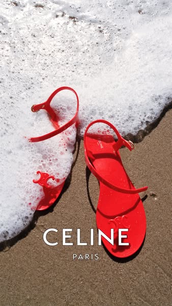 This ad showcases red sandals from the Celine brand being washed up on a beach.