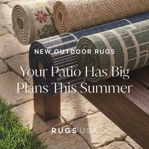 This image ad for Rugs USA features a stack of rolled outdoor rugs on a patio bench, suggesting that consumers can make 