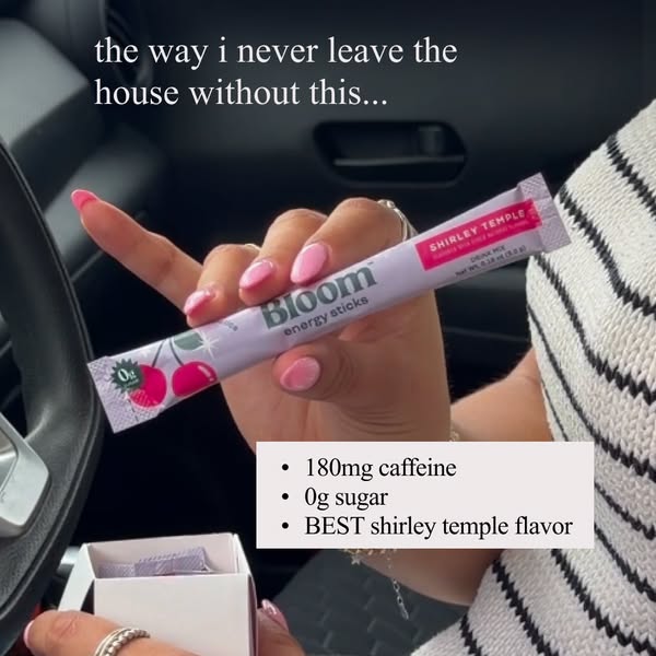 The ad features a woman in a car holding a Bloom energy stick in the Shirley Temple flavor. The ad suggests that the Blo