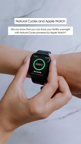 The ad shows an arm with an Apple Watch displaying the Natural Cycles app. The ad promotes the Natural Cycles app and hi