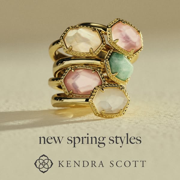 This image ad showcases a stack of Kendra Scott rings with pastel-colored stones in a gold setting and is promoting thei