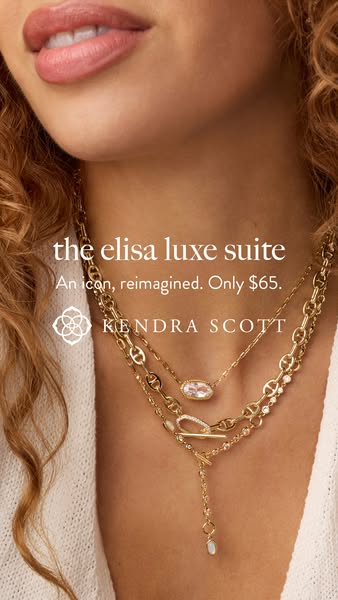 A close-up image of a woman wearing three gold Kendra Scott necklaces from the Elisa Luxe Suite. The ad emphasizes the c