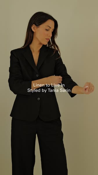 This ad features a model wearing a black linen suit. The ad highlights the suit's stylish and versatile look.