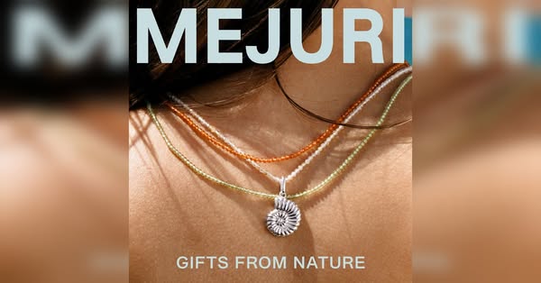 This ad features a close up view of a woman wearing Mejuri jewelry. The creative has overlaid text promoting the brand a
