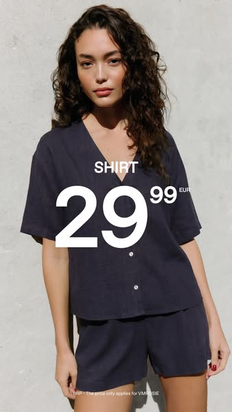 This image ad showcases a woman modeling a VMRosie shirt and matching shorts. The text overlay provides the price for th