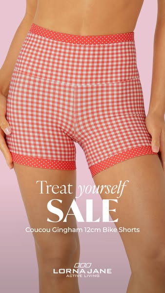 An image ad for Lorna Jane activewear that is promoting a sale on their Coucou Gingham 12cm Bike Shorts