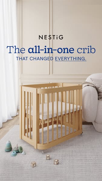 This ad features a light wood crib in a neutral-toned room. The headline emphasizes the crib's innovative design, su