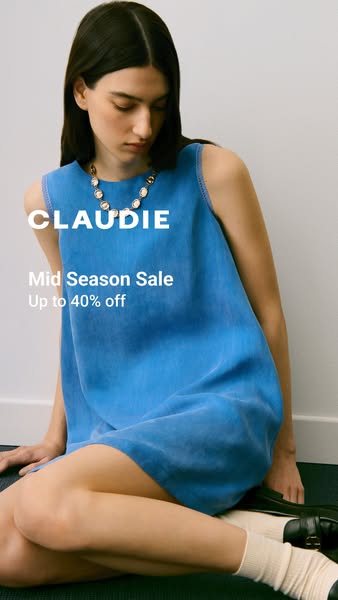 This image ad features a woman wearing a blue dress and advertises a mid-season sale of up to 40% off.