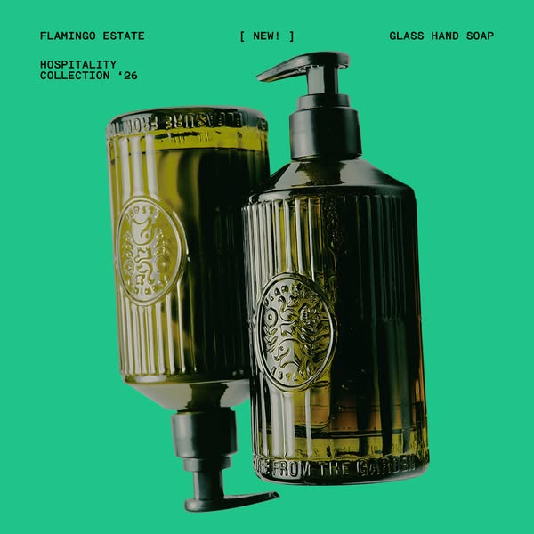 This ad showcases Flamingo Estate's Glass Hand Soap from the Hospitality Collection '26. The ad emphasizes the n