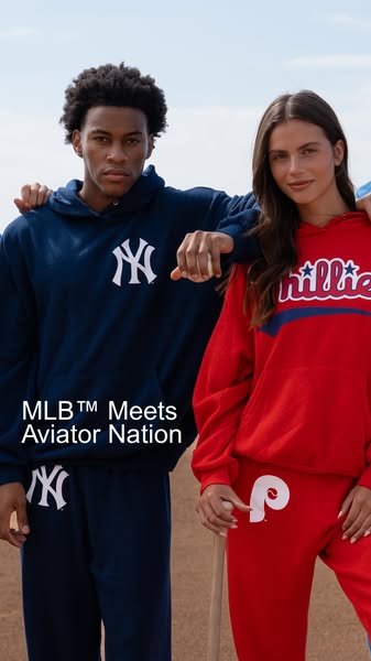 An ad for Aviator Nation's MLB collection shows a woman and a man in team-branded hoodies and sweatpants.