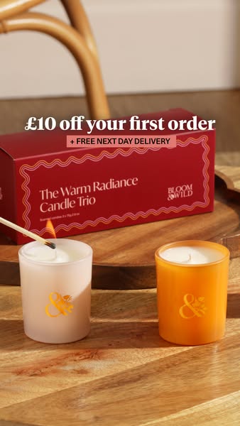 This image ad for Bloom & Wild promotes their Warm Radiance Candle Trio with an offer of £10 off the first order and