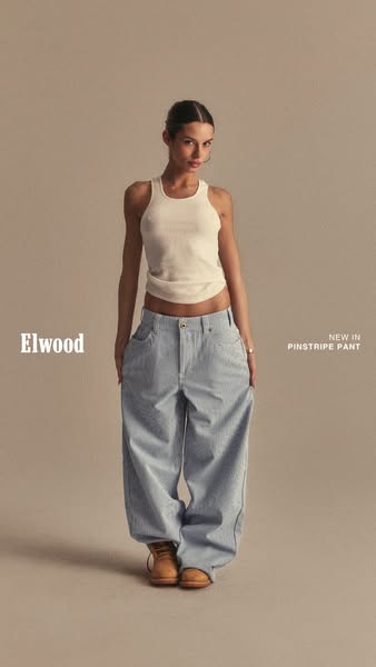 This image ad showcases Elwood's new pinstripe pants, presented on a model against a neutral backdrop.