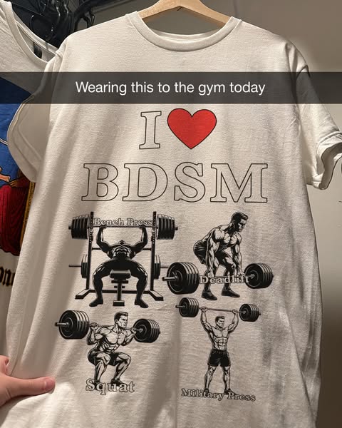 The ad features a white t-shirt with the text "I ❤️ BDSM" along with four illustrations of weightlifting exerc