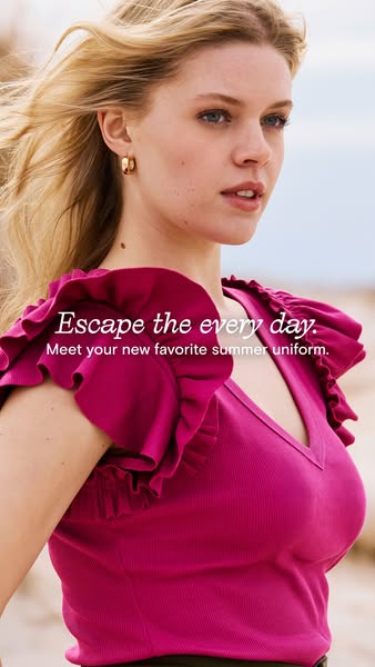 The ad features a woman wearing a ruffled-sleeve top. The text promotes it as an everyday, essential uniform piece.