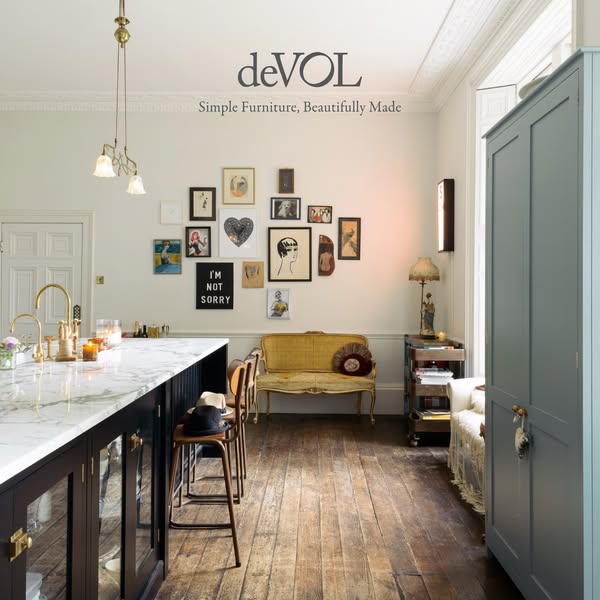 This ad showcases a well-lit, traditionally styled kitchen and dining area from deVOL, emphasizing the simple yet beauti
