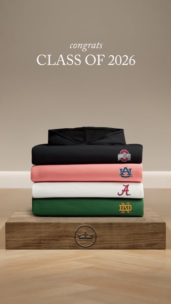 The ad features a stack of folded sweatshirts, each representing a different university, presented as a congratulatory g