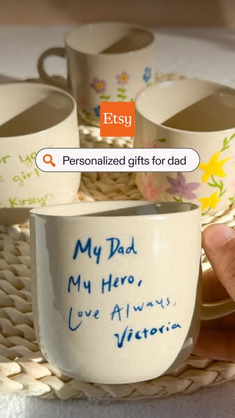This image ad showcases personalized gifts for dads from Etsy, specifically a customized mug with a heartfelt message. I