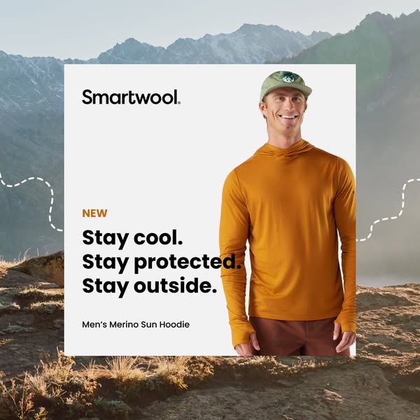 An image ad for Smartwool's Merino Sun Hoodie, featuring a man in the hoodie against a mountain backdrop, emphasizin