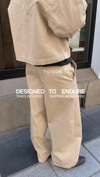 This ad features a person wearing a jacket and pants from YUXUS. The ad focuses on the durability of the products and in