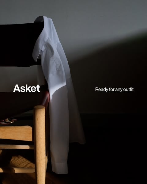 This ad showcases a white button-down shirt from Asket, emphasizing its versatility and timeless style. The minimalist a