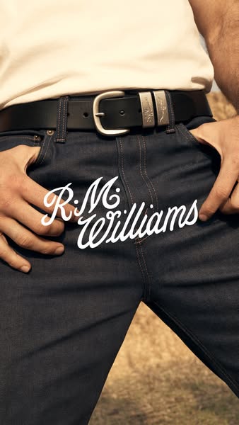 This image ad features a close up shot of R.M. Williams jeans and a belt. The photo is tightly cropped with the brand lo