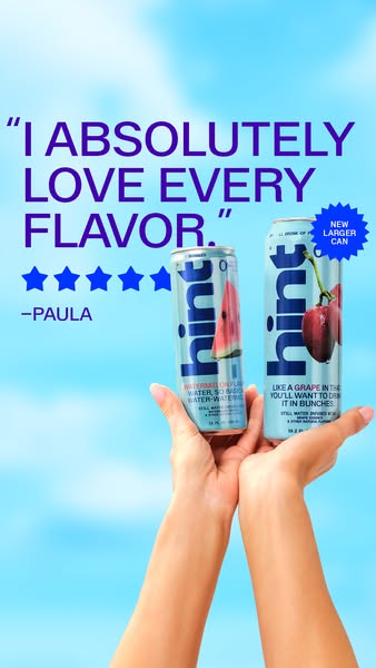 This ad features an image of two new, larger cans of Hint flavored water being held up against a sunny, blue-sky backgro
