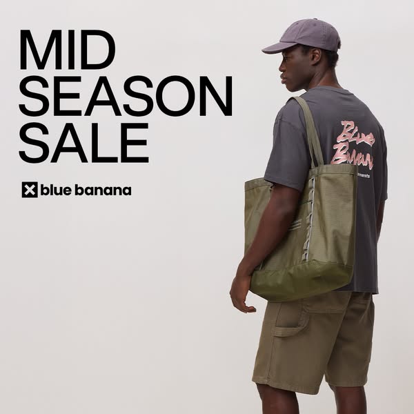 This image ad features a man modeling clothing and accessories from Blue Banana, promoting their mid-season sale.