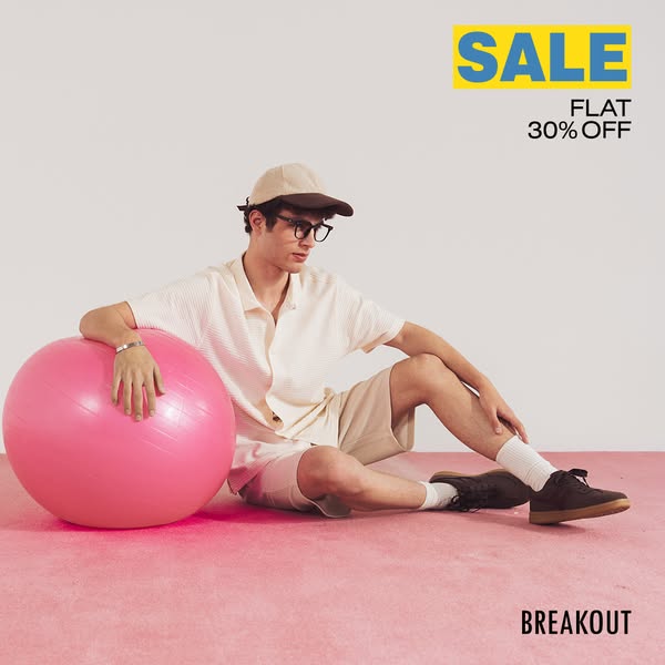 This image ad for Breakout features a man in casual clothing next to a large pink ball and promotes a sale of flat 30% o