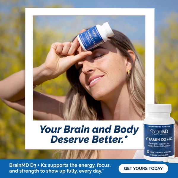 This image ad for BrainMD D3 + K2 vitamins features a smiling woman outdoors, holding the product up to her face. The ad